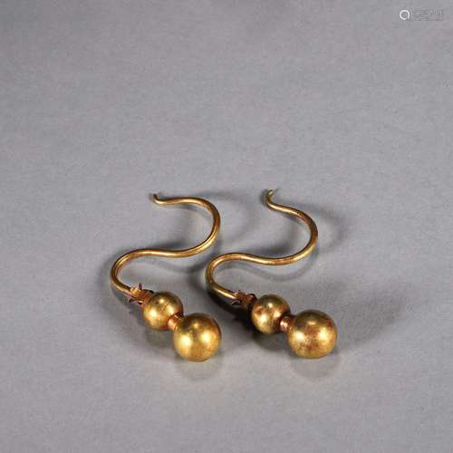 A pair of gourd shaped gold earrings