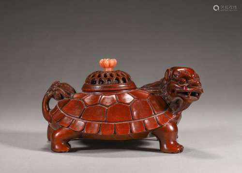 A boxwood turtle shaped incense burner