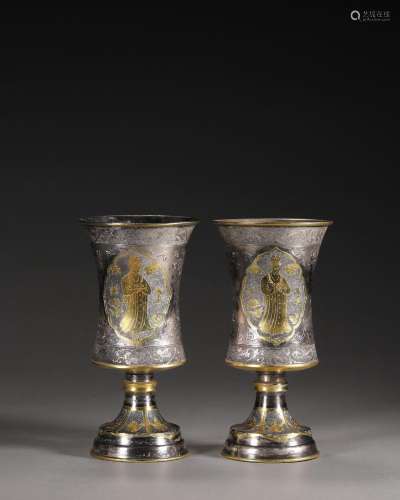 A pair of figure patterned silver cups