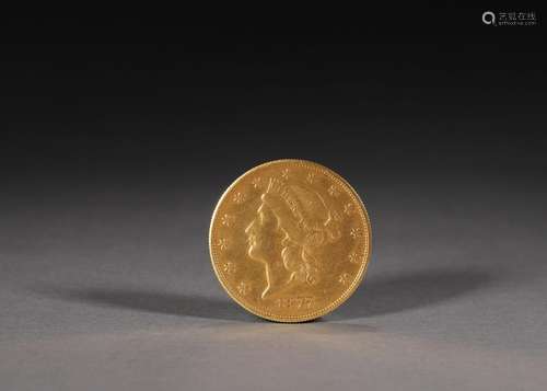 A figure patterned gold coin