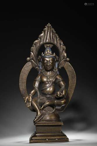 A silver-inlaid copper yellow Jambhala statue