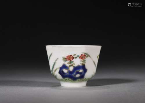 A famille rose flower and weed porcelain cup