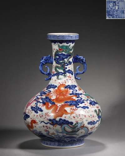 A blue and white famille rose cloud and dragon porcelain vas...