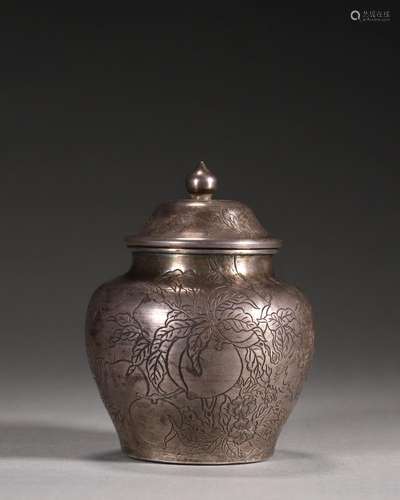 A peach patterned silver jar