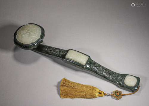 A dragon patterned jade-inlaid jasper ruyi with red sandalwo...