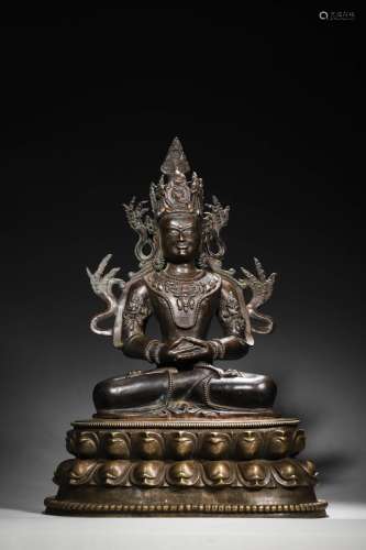 A silver-inlaid copper Amitabha buddha statue