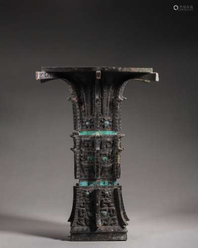 A taotie patterned turquoise-inlaid bronze zun