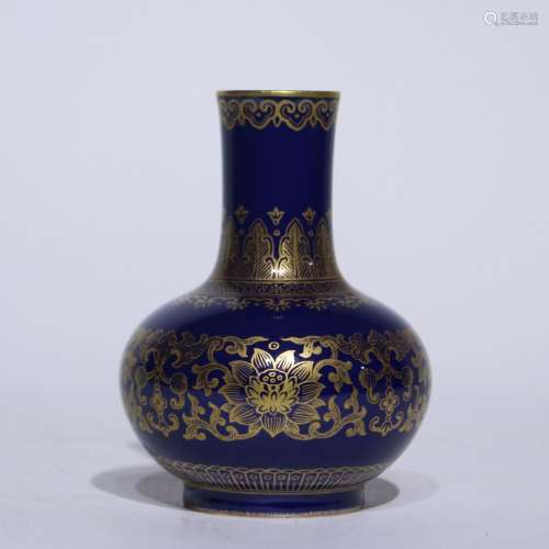 A blue glazed vase painting in gold