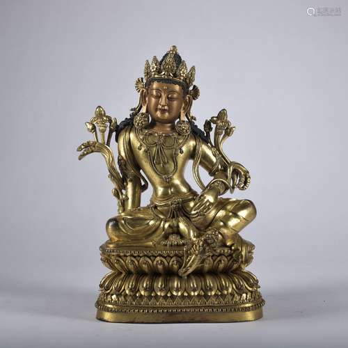 A gilt-bronze statue of Avalokiteshvara