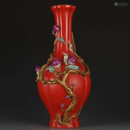 A red glazed 'peach' vase