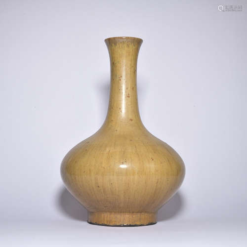 A yellow glazed vase