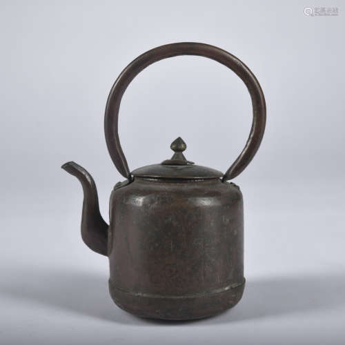 A bronze teapot