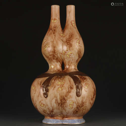 A wooden glazed gourd-shaped vase