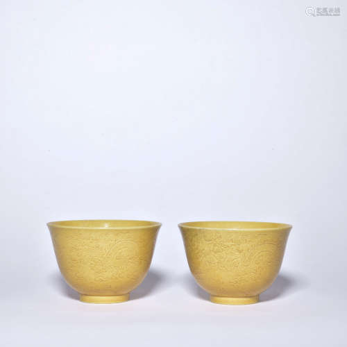A pair of yellow glazed 'dragon' cup