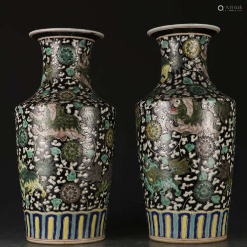A pair of Grisaille-painted 'lions' vase