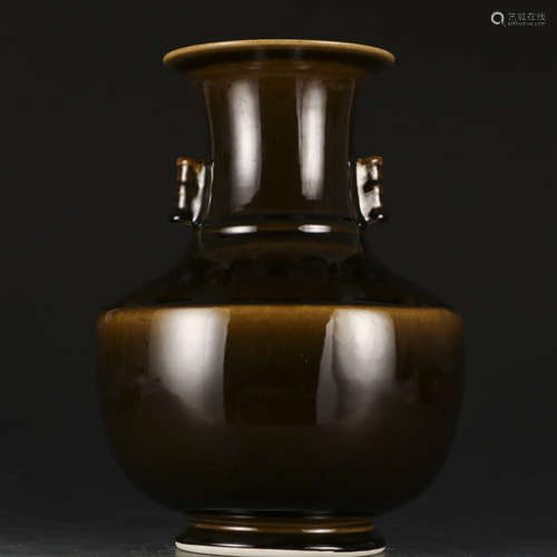 A black glazed vase