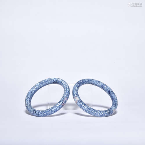 A pair of blue and white bracelet