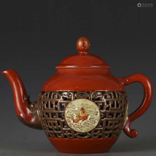 A red glazed 'fish' teapot