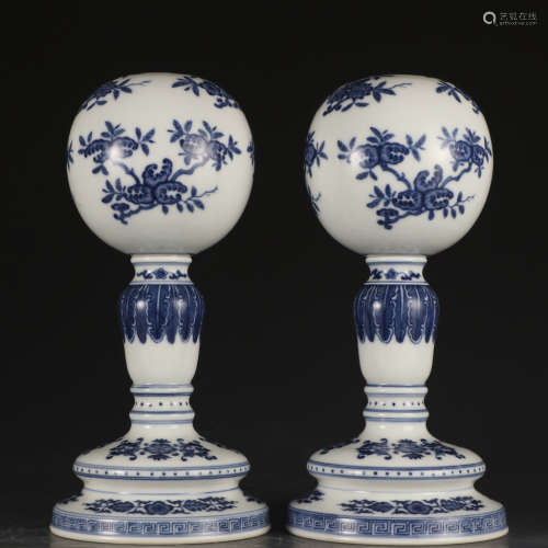A pair of blue and white hatstand