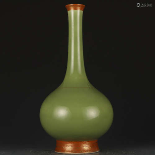 A green glazed vase