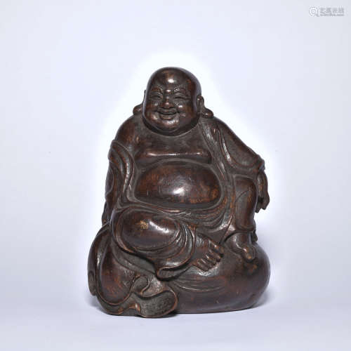 An eaglewood statue of Maitreya Buddha