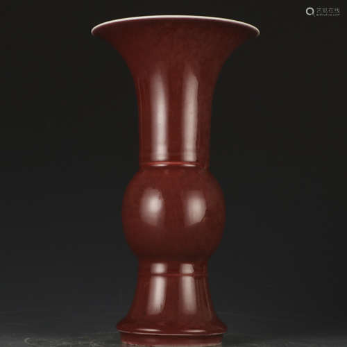 A red glazed vase