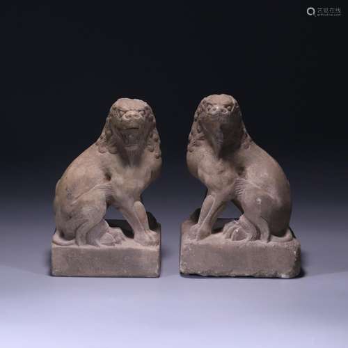 A pair of lions carved in bluestone