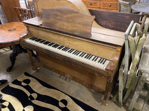 An early 20th century walnut cased upright grand piano by Mo...