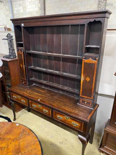A George III style banded oak dresser, with boarded rack, wi...