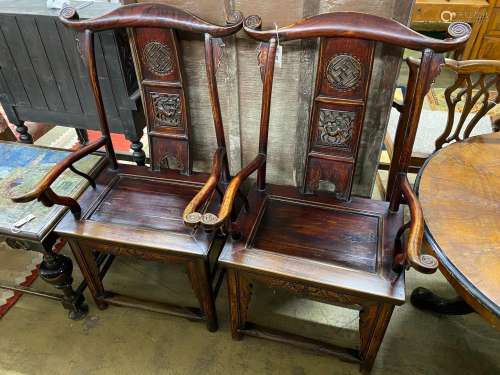 A pair of Chinese elm elbow chairs, width 63cm, depth 50cm, ...