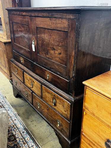 An 18th century oak low press cupboard, length 136cm, depth ...