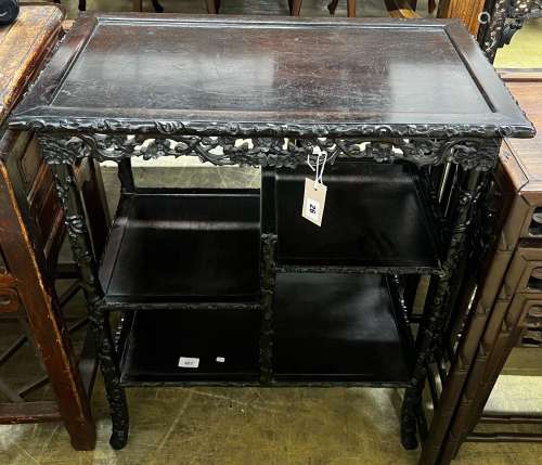 A Chinese rectangular carved hongmu tiered display table, le...
