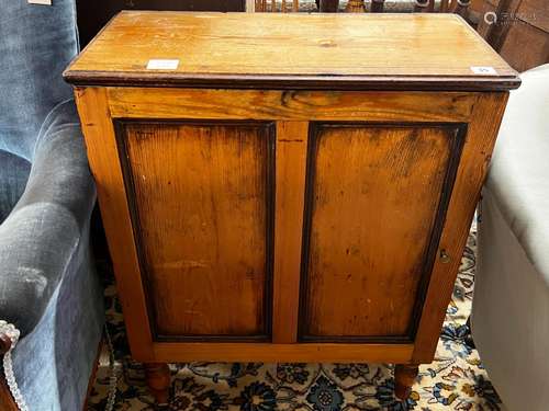 A 19th century French pine side cupboard with pigeonholed in...