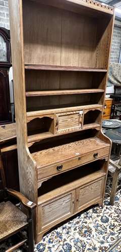 An Arts & Crafts pitch pine dresser with secretaire draw...