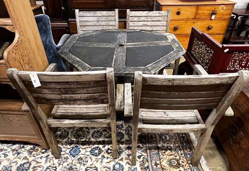 An octagonal weathered teak and mesh garden table, length 10...