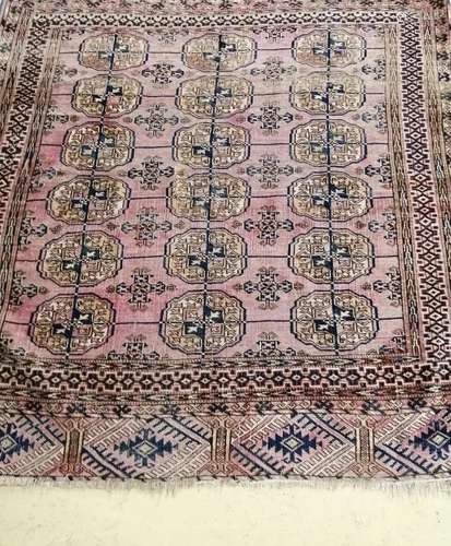 A Bokhara peach ground rug, 120 x 118cm