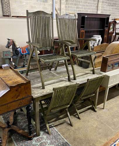 A rectangular weathered teak extending garden table, length ...