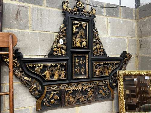 A Chinese carved parcel gilt lacquer wall plaque, width 140c...