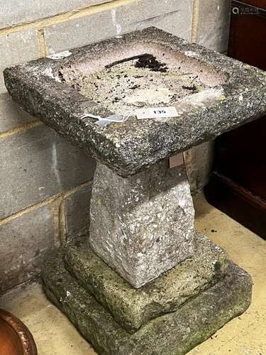 A reconstituted stone garden bird bath, width 40cm, height 6...