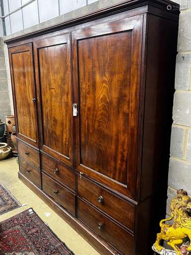 A late 18th century mahogany compactum wardrobe, fitted with...