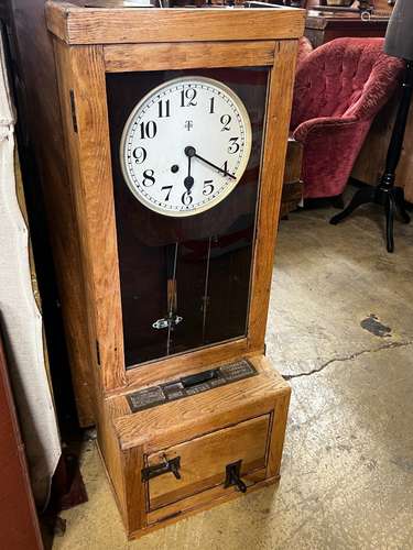 A vintage Gledhill-Brook oak cased clocking in machine, heig...