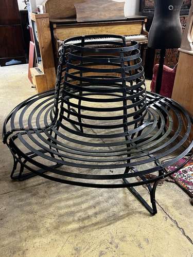 A painted wrought iron two section circular tree seat, diame...