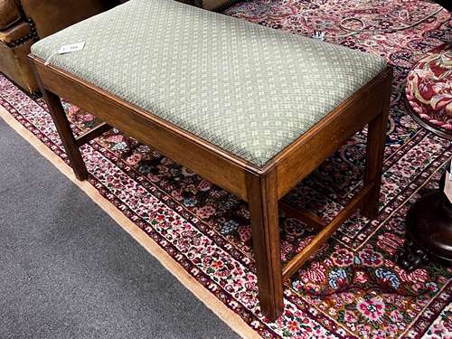 A George III style mahogany stool with upholstered drop in s...