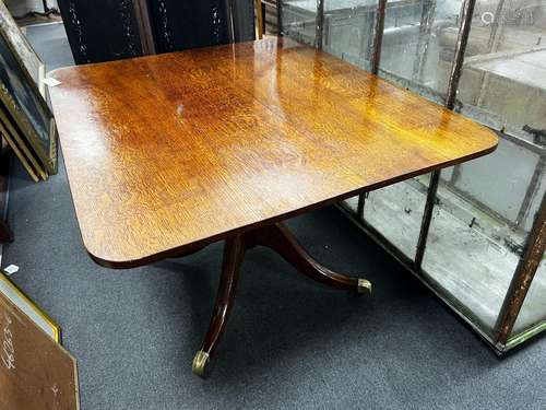 A Regency rectangular oak tilt top dining table, length 110c...