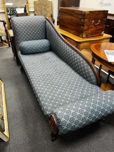 A Regency mahogany chaise longue with squab seat on fluted s...