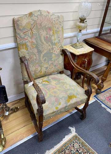 A pair of Louis XIII style walnut tapestry open armchairs, w...