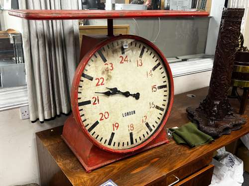 An industrial style painted metal clock console table modell...