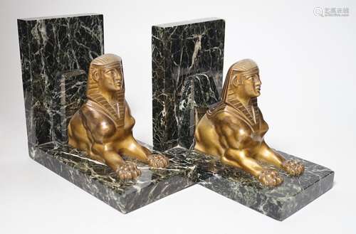 A pair of Art Deco bronze and serpentine sphinx bookends, 17...