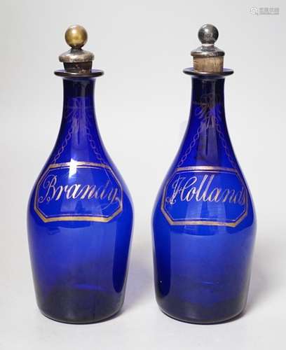 A pair of Regency blue glass decanters, labelled in gilt; Br...