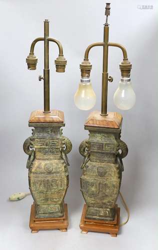 A pair of archaic Chinese bronze vases, converted into table...